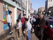 صور.. حوائط وأسوار شوارع الدقى تتحول للوحات فنية