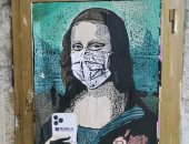 "الموناليزا" ترتدى الكمامة خوفا من كورونا.. شاهد التفاصيل