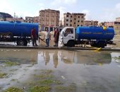 شفط مياه الأمطار من شوارع العاشر من رمضان.. صور 