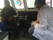 صور.. الكشف على السائقين ومحصلى التذاكر بالنقل العام بالإسكندرية للوقاية من كورونا