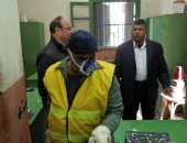 صور.. "نظافة الجيزة" تطهر المكاتب والجراجات للوقاية من كورونا