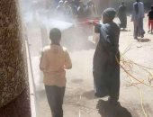 أهالى "القلمينا" بقنا يطهرون شوارع القرية للحد من انتشار فيروس كورونا