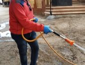 صور.. أهالى الخانكة يتطوعون بتطهير شوارعهم ضد كورونا 