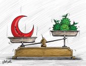 كاريكاتير صحيفة كويتية.. ميزان الصحة ينتصر على فيروس كورونا