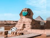 خوفا من الكورونا.. عمل فنى يظهر أبوالهول بالكمامة وتمثال الحرية بالكحول