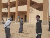 صور.. أهالى قرية منشأة خشبة بأسيوط يشاركون فى تعقيم المبانى والمساجد