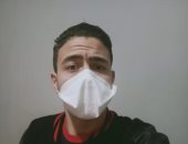 بالجوانتى والكمامة.. قارئ يشارك فى مبادرة "اليوم السابع" للوقاية من كورونا