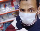 ضمن مبادرة اليوم السابع.. محمد حسن: أرتدى الجوانتى والكمامة بالصيدلية 