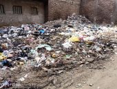 قارئ يشكو انتشار القمامة بشارع فوزى الجمنى ببولاق الدكرور
