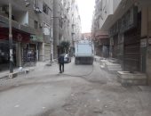 مدينة بنها تطهر الشوارع خلال فترة حظر التجوال.. صور