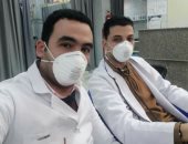 بالكمامة والجوانتى.. أطباء مركز القلب بالمحلة يؤدون عملهم