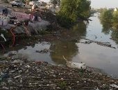 قارئ يشكو تراكم للقمامة والحيوانات النافقة بترعة بمدخل قرية بطرة بالقليوبية