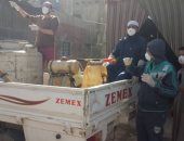 شباب قرية الكداية بالجيزة يطهرون الشوارع للوقاية من فيروس كورونا