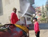 أهالى شربين بالدقهلية يطهرون الشوارع للوقاية من العدوى بفيروس كورونا 