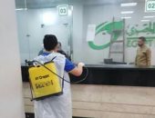 أهالى الحوامدية بالجيزة يعقمون مكتب البريد والشوارع لمكافحة كورونا