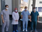 صور.. عودة أطباء جامعة أسيوط بعد قضاء 14 يوم عمل بمستشفى العزل بأتوتيج