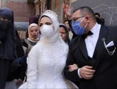 بالكمامة والكحول.. زفاف "مصطفى ونهى" فى زمن كورونا بقليوب