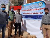 موظفو زراعة الوادى الجديد تصنعون بوابة تعقيم بالجهود الذاتية.. صور