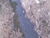 قمامة على جانبى ترعة قرية دهروط.. وأهالى المنيا يناشدون إزالتها