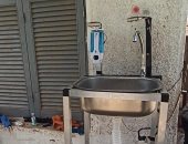 طلاب جامعة أسوان يبتكرون حوضا لتعقيم الأيدى أتوماتيكيًا لمواجهة كورونا