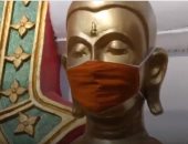 تمثال بوذا يرتدى الكمامة فى زمن كورونا.. فيديو