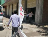 صور .. حملات لإزالة الإشغالات وتطبيق قرار غلق المحلات بأحياء الإسكندرية