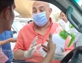 "الجيزة" تبدأ توزيع كمامات وأدوات تعقيم بالمواقف لمواجهة كورونا.. صور