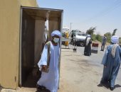 كشف وتعقيم للمواطنين القادمين من خارج الوادى الجديد بكمين بغداد ..صور