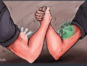 كاريكاتير صحيفة إماراتية.. كورونا.. والتحدى لعلاج الفيروس