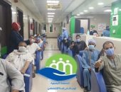  صور.. مستشفى إسنا للحجر الصحى تعلن خروج 14 شخصا عقب التعافى من كورونا