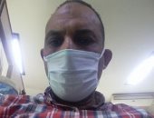 بالكمامة.. "هيثم" يشارك بصورته خلال أداء عمله والتزامه بالإجراءات الوقائية