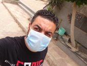"أشرف" من المنيا يشارك صورته خلال ارتداء الكمامة التزاما بالإجراءات الوقائية 