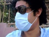 "أحمد" من بنى سويف يشارك صورته خلال ارتداء الكمامة التزاما بإجراءات الوقاية