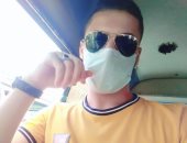 "أحمد" يشارك صورته بالكمامة من بنى سويف والالتزام بالإجراءات الوقائية