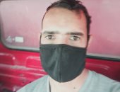 "أحمد" يشارك صورته بالكمامة خلال عمله بالجيزة والالتزام بالإجراءات الوقائية