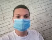"يوسف" من سوهاج يشارك صورته بالكمامة التزاما بالإجراءات الوقائية