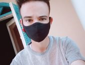 "محمد" من سوهاج يشارك صورته بالكمامة التزاما بالإجراءات الوقائية