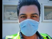 "محمد" من القاهرة يشارك صورته بالكمامة التزاما بالإجراءات الوقائية