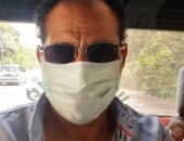 "صابر" من أسيوط يشارك صورته بالكمامة التزاما بالإجراءات الوقائية
