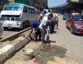 صور.. حملات نظافة بالجيزة وضبط مقهى يقدم الشيشة