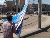 صور.. أحياء الإسكندرية تواصل إزالة الإعلانات المخالفة لمرشحى الشيوخ