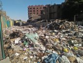 شكوى من تراكم القمامة فى شارع السوق ببولاق الدكرور