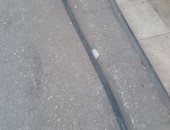 كابل كهرباء مكشوف فى شارع شلش بالمطرية يهدد المارة