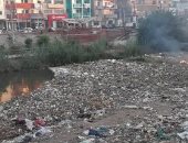 شكوى من تراكم القمامة بترعة الملاح وكوبرى السادات فى أسيوط