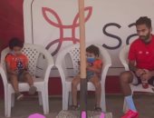 حسين الشحات يصطحب ابنيه فى مران الأهلي.. صور 