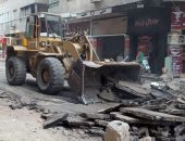 رصف شارعى قرة بن شريك وهمدان بجنوب الجيزة.. صور