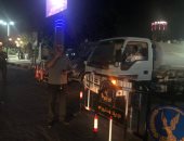 تمركز سيارات شفط المياه بشوارع وميادين حى الدقى استعدادا للطقس السيئ.. صور