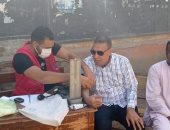 حملة 100 مليون صحة ترفع شعار "انتخب واكشف" أمام اللجان في قنا.. صور