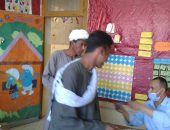 الشباب يتوافدون على الصناديق للإدلاء بأصواتهم فى أسوان.. صور