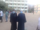 قمص وإمام مسجد يدليان بصوتهما فى انتخابات النواب ببنى سويف.. صور
